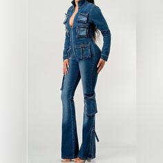 Stretch Premium Denim Cargo Jumpsuit. Fitted Dark Wash Cargo Jeans For Fall, Fitted Utility Jeans In Dark Wash, Fitted Dark Wash Utility Jeans, Dark Wash Fitted Utility Jeans, Fitted Utility Jean Overalls, Fitted Utility Pants In Medium Wash, Fitted Denim Cargo Jeans For Fall, Fitted Utility Jeans In Medium Wash, Fitted Medium Wash Cargo Jeans For Fall