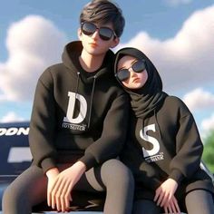 two people sitting on the hood of a car wearing black sweatshirts and sunglasses, both with their arms around each other's shoulders