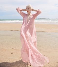 Summer Beach V-neck Chiffon Dress, Chiffon V-neck Dress For Beach Cover-up, Breezy Pink V-neck Maxi Dress, Pink Flowy Breezy Dress, Long Sleeve Chiffon Beach Dress, Spring Breezy Long Maxi Dress, Feminine V-neck Boho Dress For Beach, Flowy Long Sleeve Breezy Beach Dress, Pink V-neck Boho Dress For The Beach