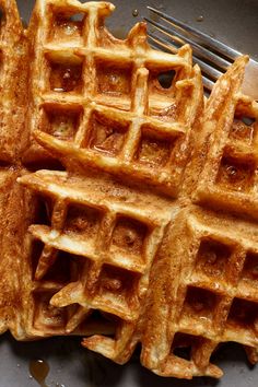 some waffles are on a plate with a fork