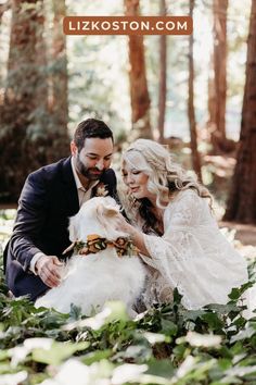 a bride and groom pose with their dog in the woods for an article on wedding photography