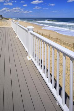 The TimberTech Classic Composite Series is designed for simplicity with endless design options, combines four railing collections into one. Our most popular collection offers multiple top rail and infill choices to make your outdoor living space truly yours. It uses the Universal Rail system and allows you to select from four top rail options: Premier Rail®, RadianceRail®, Trademark Rail™, Contemporary, and a Drink Rail option. Get the look of custom millwork railings without the time-consuming upkeep that comes along with traditional wood. The 4-sided capped composite material ensures timeless beauty for years to come. Designed to complement your deck as well as your home’s exterior. Premier Railing has a classic flat-topped Victorian profile, and is available in five colors. TimberTech C Drink Rail, Deck Handrail, Wood Deck Railing, Porch Railing Designs, Composite Railing, Deck Railing Systems, Front Porch Railings, White Deck, Balcony Railing Design