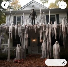 a man standing on top of a house covered in icicles