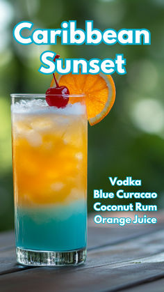 a blue curacao cocktail with an orange slice on the rim and text that reads, caribean sunset