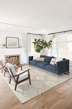 a living room filled with furniture and a fire place