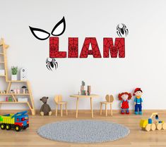 a child's playroom with toys and wall decals that spell out the word lama