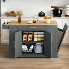 a kitchen island with an open door in the center and shelves on both sides to store food