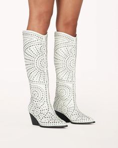 Zachariah by Billini is a statement embellished long boot. Go full glam in this silver studded long boot, the ideal style to elevate your festival outfit or off-duty look. Featuring; low stacked block heel closed pointed toe structured upper silver stud embellishments in statement design synthetic upper, lining and out Knee High Western Boots, Last Rodeo, Cowgirl Look, Western Style Boots, White Studs, Rush Dresses, Rodeo Outfits, Full Glam, Glass Slippers