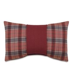 a red plaid pillow on a white background