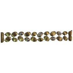 an image of a bracelet with stones on it