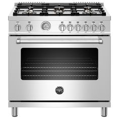 a stainless steel stove with four burners and two ovens on each side,