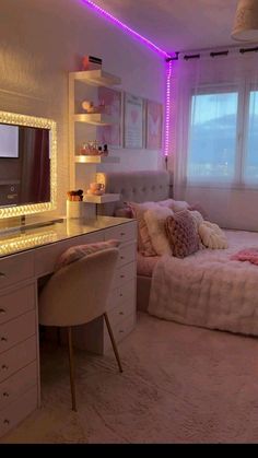 a bedroom with a bed, desk and mirror