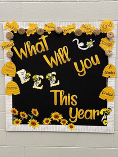 a bulletin board that says what will you do this year? with sunflowers on it