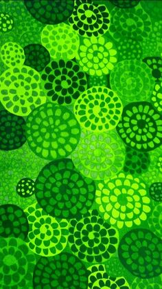 an abstract painting with green and black circles