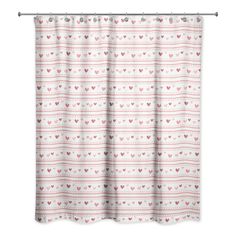 a pink and white shower curtain with hearts printed on the bottom, in front of a white background