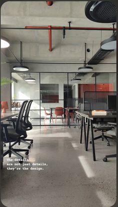 an empty office with chairs and desks