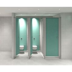 two urinals in a bathroom with green doors