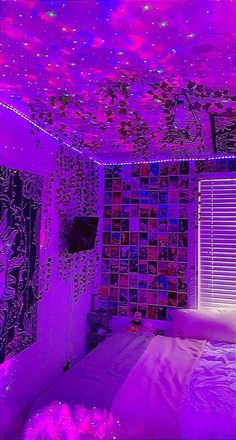 a bed room with a neatly made bed and purple lights on the ceiling above it