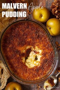 an apple pudding in a glass dish with apples around it and the words, malvern pudding