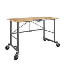 Take the SmartFold portable work desk anywhere the work is. When your work is done, simply fold and store away. Made with industrial-strength steel, this utility table has a weight capacity of 400 pounds on the Hardwood top shelf. The two locking casters allow you to keep it in place while you work. Folds in seconds, saving you time and storage space. With plenty of leg room under the desk top and a large working surface, this versatile work desk is ready to handle any DIY project. Cosco Rolling Grey with Hardwood Top Hardwood Portable Work Bench | 66760DKG1E Workbench On Wheels, Workshop Bench, Steel Workbench, Dark Grey Rooms, Portable Workbench, Folding Workbench, Grey Desk, Craft Desk, Grey Room