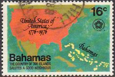 a stamp with the map of the united states in orange and green, on a blue background