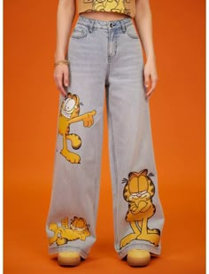 Get cat walk ready with these Garfield denim pants! They have a light wash and wide leg silhouette. Bursting with cat-titude, these pants feature Garfield printed on the legs in various poses. Comes with classic 5-pocket styling. Garfield Pjs, Orange Clothes Aesthetic, Garfield Clothes, Garfield Outfit, Garfield Merch, Garfield Aesthetic, Tiktok Aesthetics, Garfield Costume, Artsy Clothes