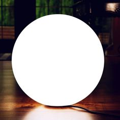 a white light sitting on top of a wooden table