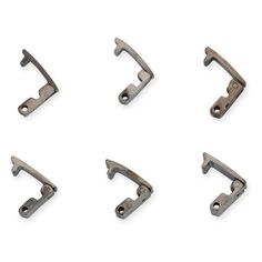 four pieces of metal hardware on a white background