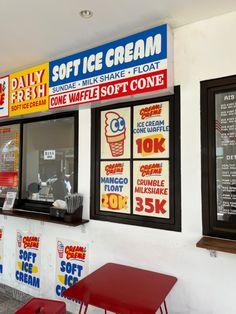 an ice cream shop with posters on the wall