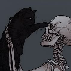 a black cat sitting on top of a human skull next to a skeleton holding it's head