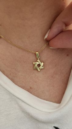 ★MAGEN DAVID GOLD PENDANT★ My specially designed Star of David collection in various designs & sizes. 14K solid gold necklace. The Magen David is a known Jewish symbol, symbolizes the connection between God, Israel, and the Torah. It can also symbolize the seven virtues (kindness, severity, harmony, perseverance, splendor, foundation, and royalty) Star of David necklaces can be worn by people of all genders and ages. Necklace Details: ★ Solid 14K gold, Choose your gold color yellow gold / white gold / rose gold ★ Matte & shiny finish ★ Measurements: 12mm (0.47 inch) wide, 21mm (0.82 inch) long including bail ★ Chain sold separately My service: ★ Free Shipping 2-3 days, with DHL express door to door ★ Made to order, ready to ship in 1-2 weeks ★ Jewelry certificate & insurance appraisal is i 14k White Gold Star Of David Necklace, Star Of David Tarnish Resistant Necklace Gift, Classic Yellow Gold Star Of David Jewelry, Classic Star-shaped Necklace As Gift, Classic Star-shaped Necklace For Gift, Classic Star Of David Jewelry For Gift, Classic Star Shaped Necklace For Gift, 14k Yellow Gold Star Of David Necklace, Gold Sterling Silver Star Of David Necklace