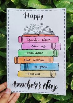 a hand holding up a card that says happy teacher's day with books on it