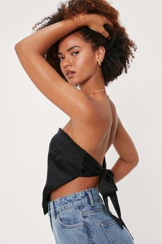 The EMES SHOPtop is detailed with astrapless bandeau neckline. and triangle front hem. Features a completely open back. and tie closure. This cute and effortlessly cool top is perfect for a hot summer day.MATERIAL:80% Soft Poly. 20% Cotton MEASUREMENTS:Small : 4-6 Chest: 33-34.5 in Length: 13.4" in Medium : 6-8 Chest: 34.5-36 in Length: 13.8" in Large : 8-10 Chest: 36-37.5 in Length: 14.2" in Satin Crop Top Diy, Black Satin Top Outfit, Satin Crop Top Outfits, Femme Fatale Aesthetic Outfit, Satin Tops Blouses, Crop Top Diy, Satin Top Outfit, Blue Satin Top, Back Tie Top