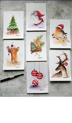 six christmas cards with pictures of animals hanging from them