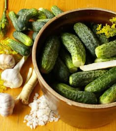 cucumbers and garlic in a bowl with the words homemade pickles recipes