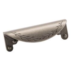 a metal door handle with leaves on the front and back end, in an antique style