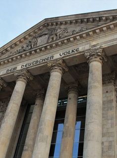 an old building with many pillars and windows