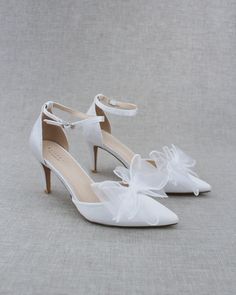 "Classic satin pointy toe heels topped with white organza bow on vamp and ankle strap for sweeter and romantic look. Perfect for brides, bridesmaids, wedding party, or evening wear. DETAILS: HEELS: 3 inches COLORS AVAILABLE: White UPPER: Synthetic upper and lining MATERIALS: Manmade outsole ORIGIN: Imported STYLE NAME: BELL Not sure of which size to purchase? Shoes measurements are as follow: (Please note measurements taken the length of inside of shoe from toe to heel). Size 5 - 9.50\" Size 6 - Bridesmaids Shoes, Organza Bow, Wedding Shoes Bride, Holiday Shoes, Pointy Toe Heels, Short Heels, Bridesmaid Shoes, Satin Heels, Wedding Heels