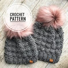 the crochet beanie with two pom - poms is shown in grey and pink