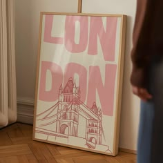 a person standing next to a poster on the floor