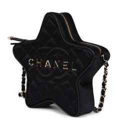 This Chanel quilted CC star bag is in black satin fabric with light gold hardware and features an exterior back slip pocket, dual zip top closure and an interwoven light gold chain link and black satin leather shoulder strap.The interior is lined in black grossgrain canvas and black leather with two open slip pockets on each wall.Collection: 24C (RFID)Origin: FranceCondition: New and never worn Accompanied by: Chanel box, Chanel dustbag, retail UPC, RFIDMeasurements: 8.5" width x 7.25" height x 2" depth; 19" strap drop Chanel 2024, Star Bag, Black Satin Fabric, Chanel Box, Chanel Store, Chanel Cruise, Eyewear Shop, Couture Mode, Madison Avenue