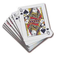 four playing cards are stacked on top of each other, with one card in the middle