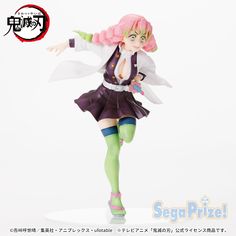 an anime figurine with pink hair and green eyes is posed in front of a white background