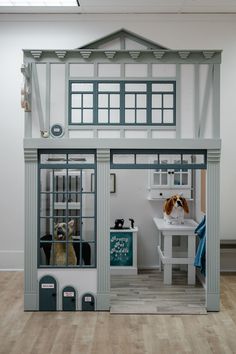 a doll house with a dog in it