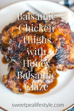 balsamic chicken thighs with honey balsamic glaze on a white plate