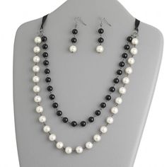 Handcrafted Retro Black White Glass Pearl Beads Necklace Earrings Jewelry Set Handcrafted necklace and earring jewelry set A modern take on the classic glass pearl theme Black and white glass pearl beads with silver tone steel metal Measures about 24" long with ribbon tie for adjusting length SKU: PD 1113 Pearl Theme, Pearl Beads Necklace, Artisan Jewelry Necklaces, Handcrafted Artisan Jewelry, Handcrafted Necklace, Earring Jewelry, Ribbon Tie, Beads Necklace, Steel Metal