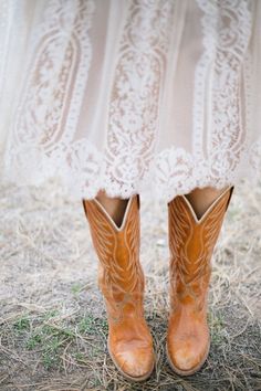 a close up of a person wearing cowboy boots