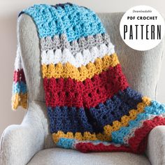 a crocheted blanket sitting on top of a chair