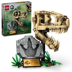 a lego dinosaur is shown next to the box