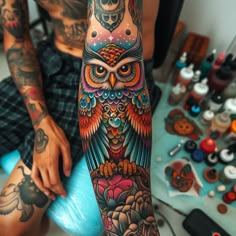 an owl tattoo on the arm and leg is shown in full color, with other tattoos surrounding it